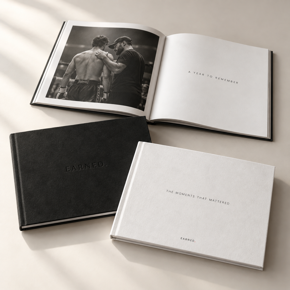 EARNED. black and white material photobooks with monochrome fight photography